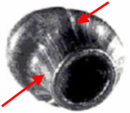 Illustration 2. Red arrows point to the groove markings on the outside of a deformed bullet.