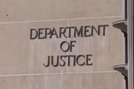 Photo of Department of Justice lettering on building
