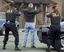 Photo of DEA agents making an arrest