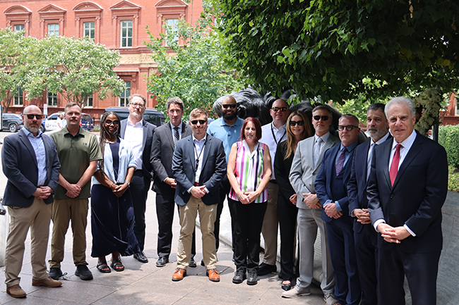 Current and former OIG employees at the National Law Enforcement Memorial in Washington, D.C. June 2026