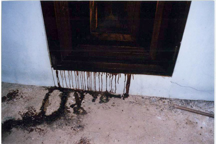 Figure 11 (Photo of Doorway Bloodstain After the Body was Moved)