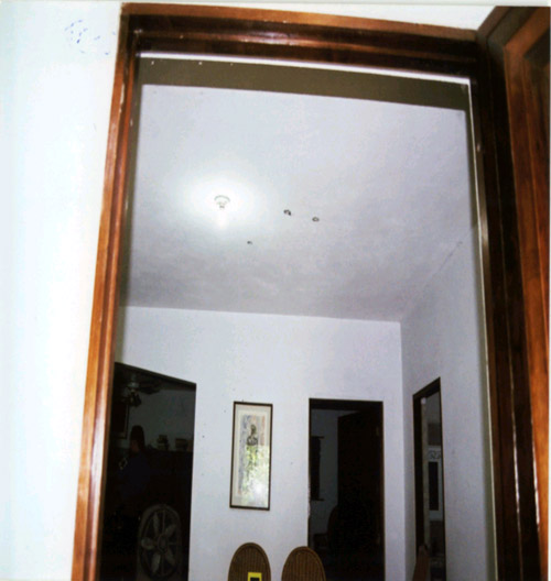 Figure 13 - Photo of Ceiling Impacts from Shots Through Front Door