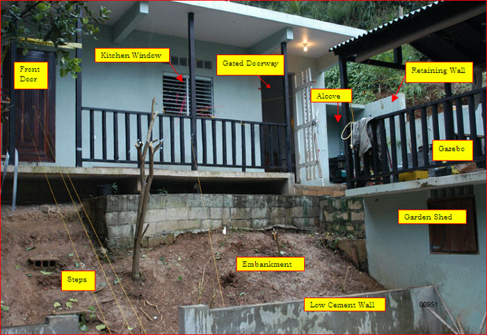 Figure B (Photo of front side of residence with foliage removed). Important features are labeled.
